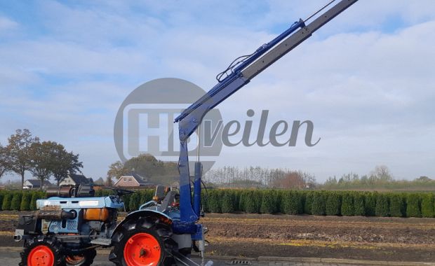 Tractor met hijskraan  